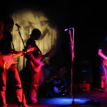 Bassist performing with a rock band